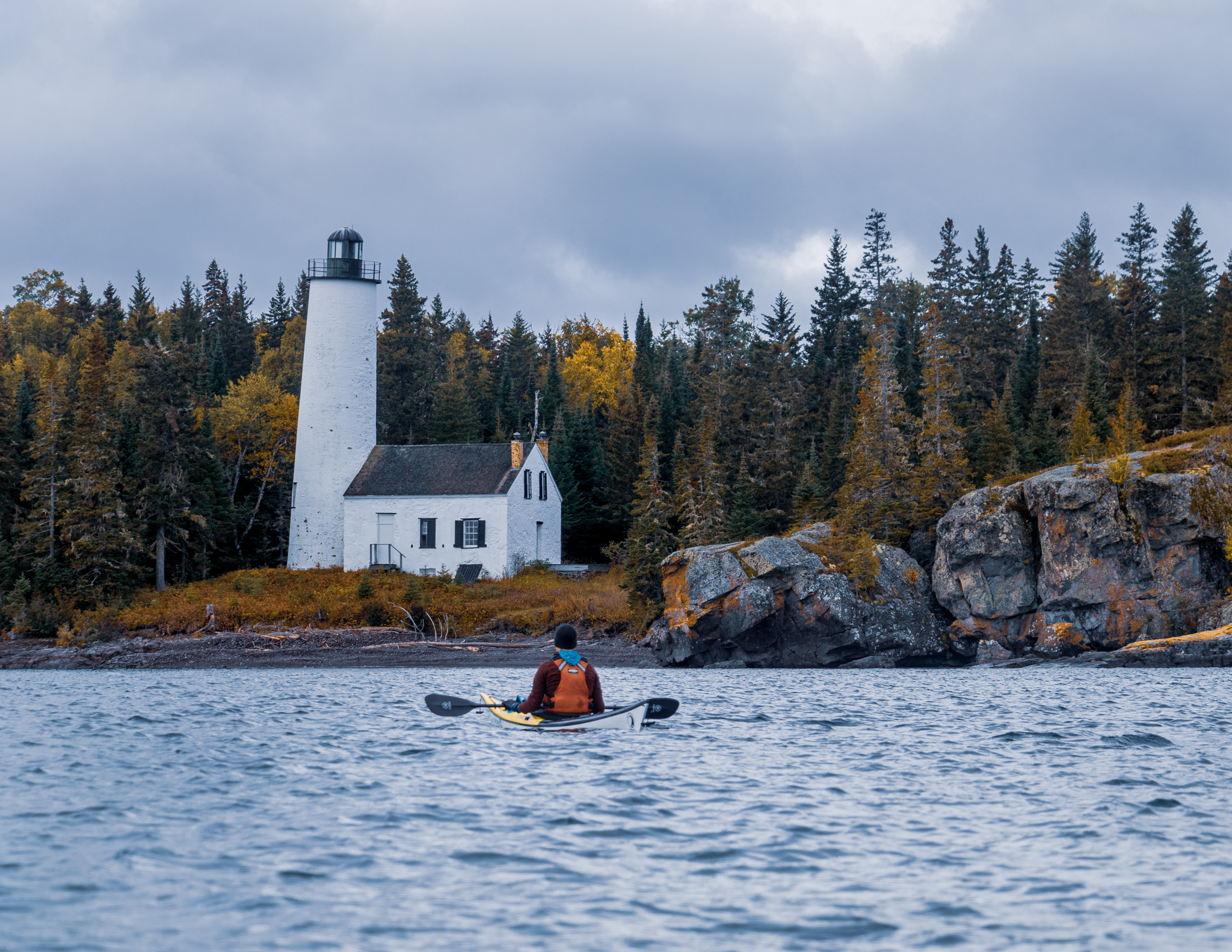 A Kayaker in front of the Rock Harbor Light on Isle Royale; Hidden Gems of the Northern Great Lakes