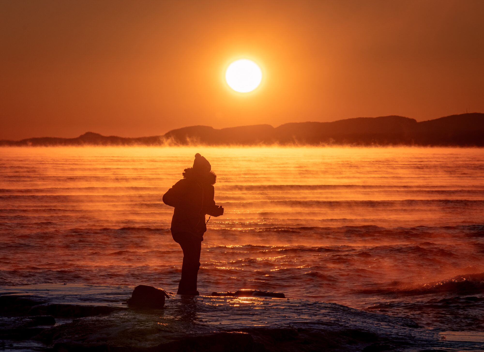 a photographer chasing winter sunrises on Lake Superior's North Shore
