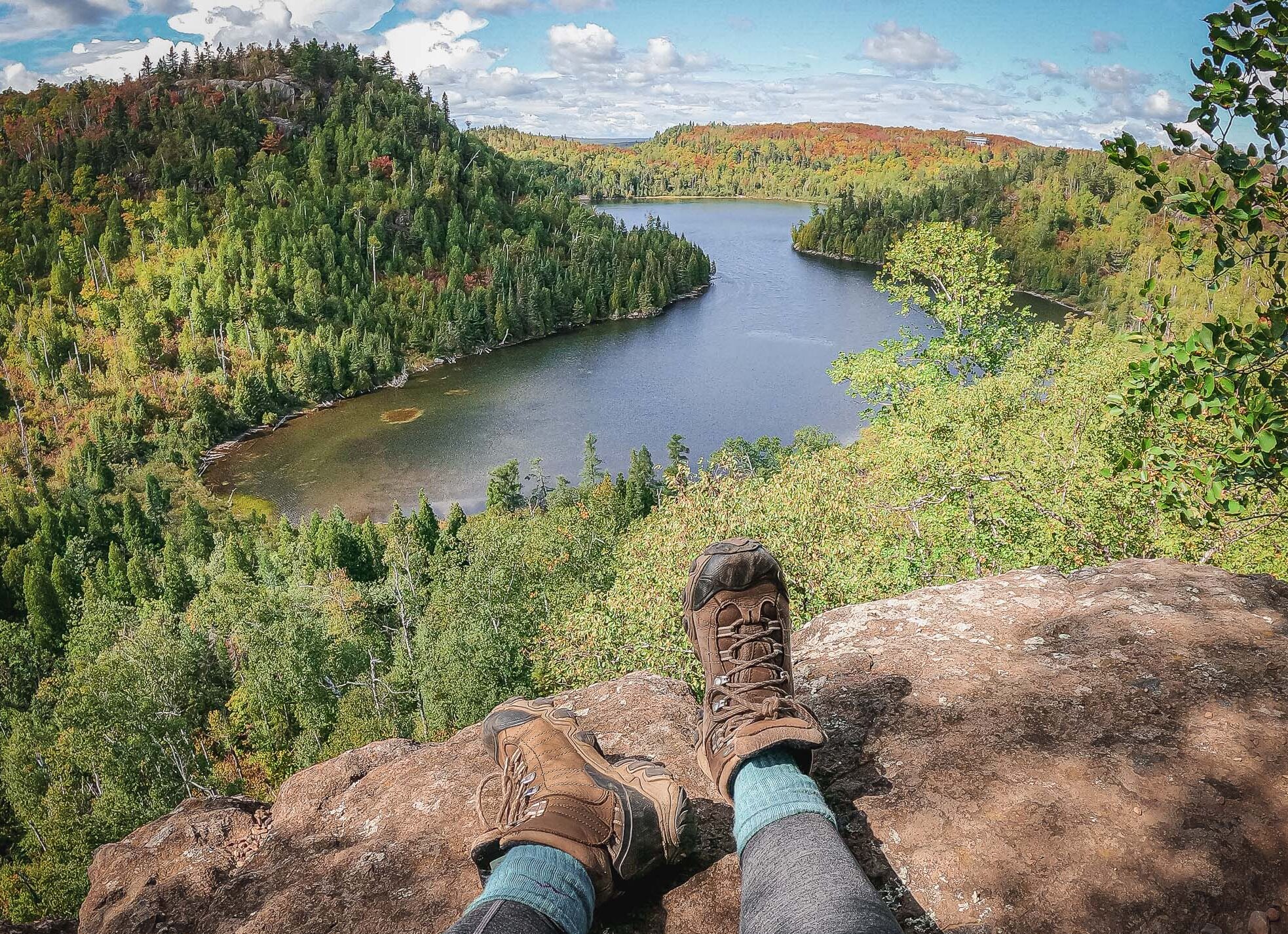 Image of Hiker's feet in front of Johnson Lake Overlook on the Superior Hiking Trail