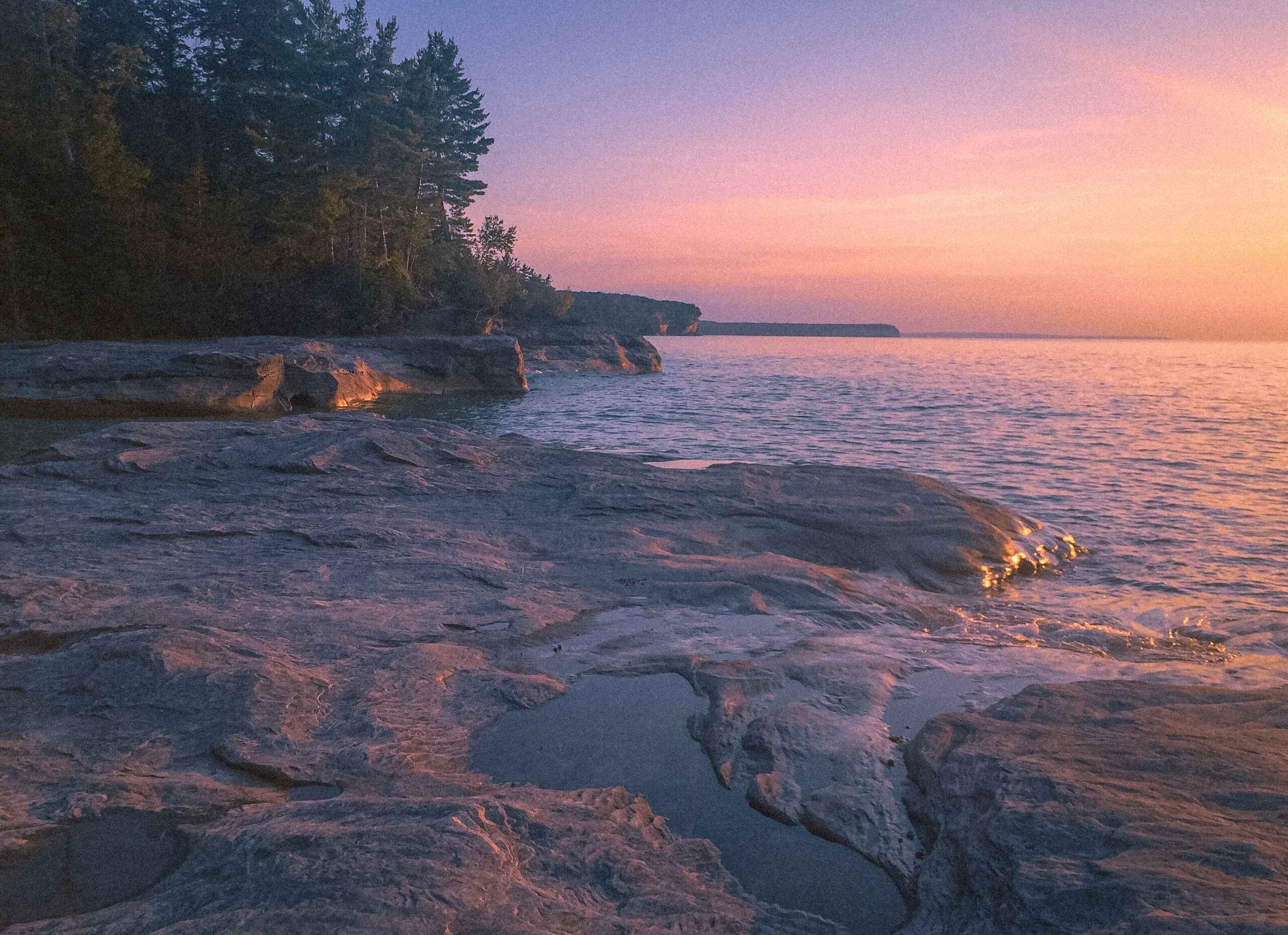 image of a cove in michigan at the pictured rocks at sunset