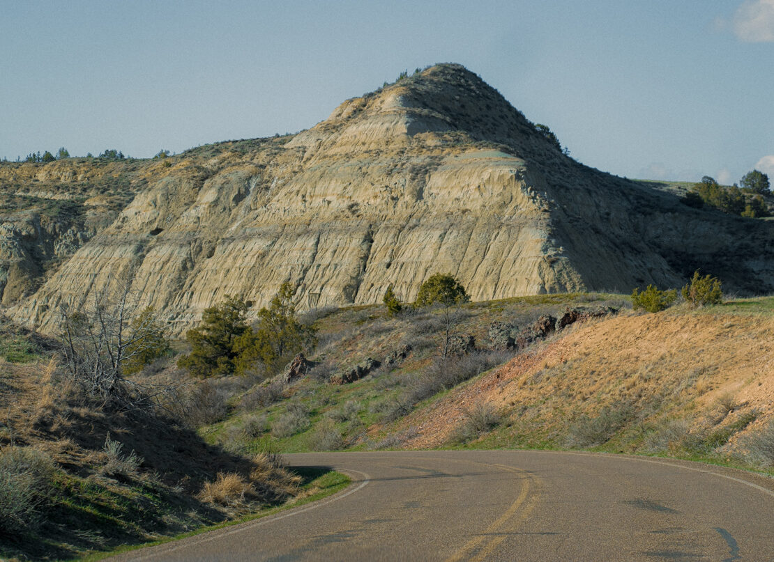 image of a road winding into Theodore Roosevelt National Park