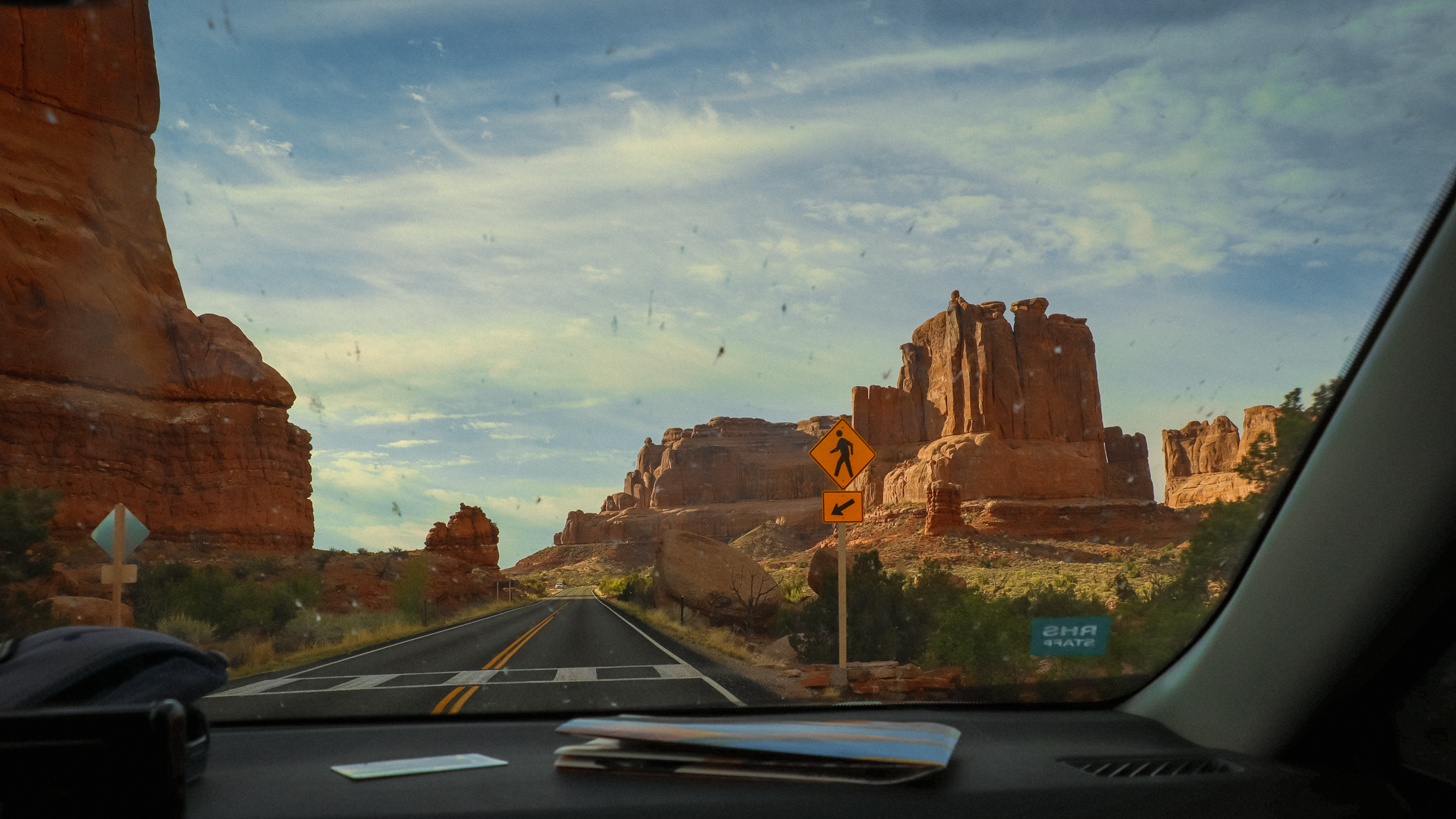 image of driving through arches national park at sunrise